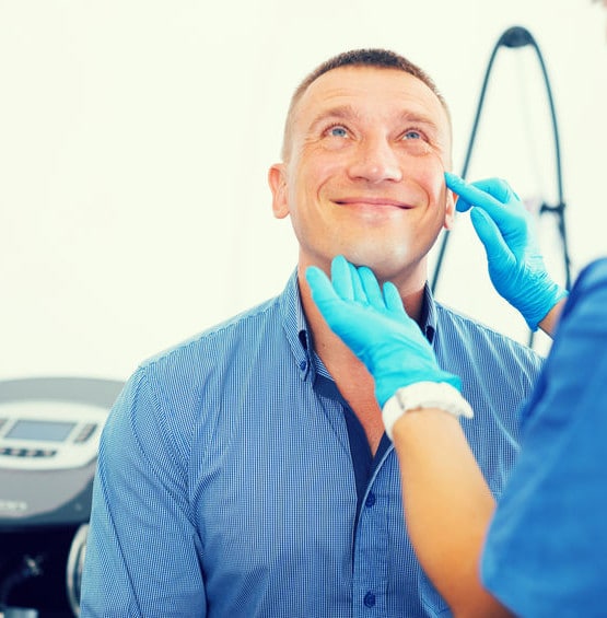 Woman doctor is examining patient before the procedure in estetic clinic.